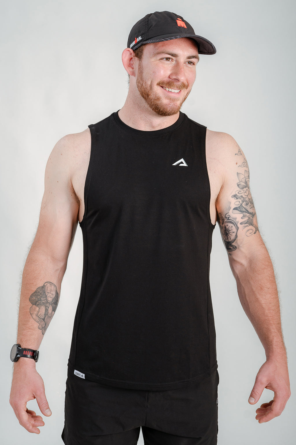 StagFit Performance drop arm tank top black — front view on model.