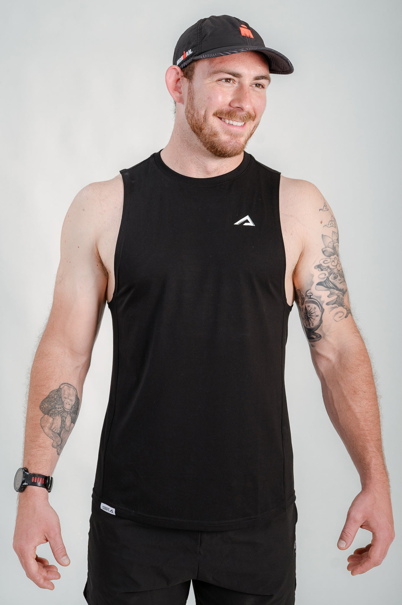 StagFit Performance drop arm tank top black — front view on model.