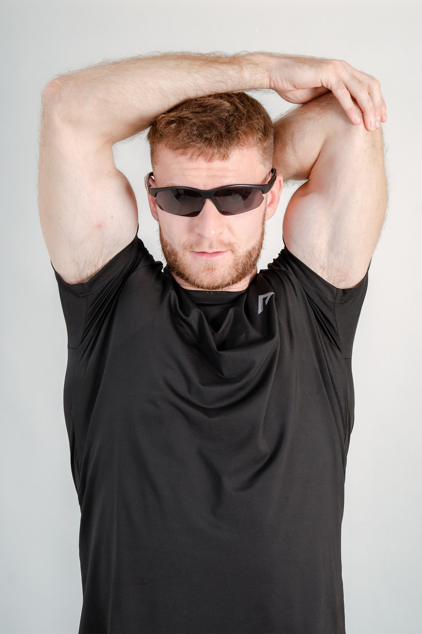 Model wearing sunglasses and StagFit black t-shirt.