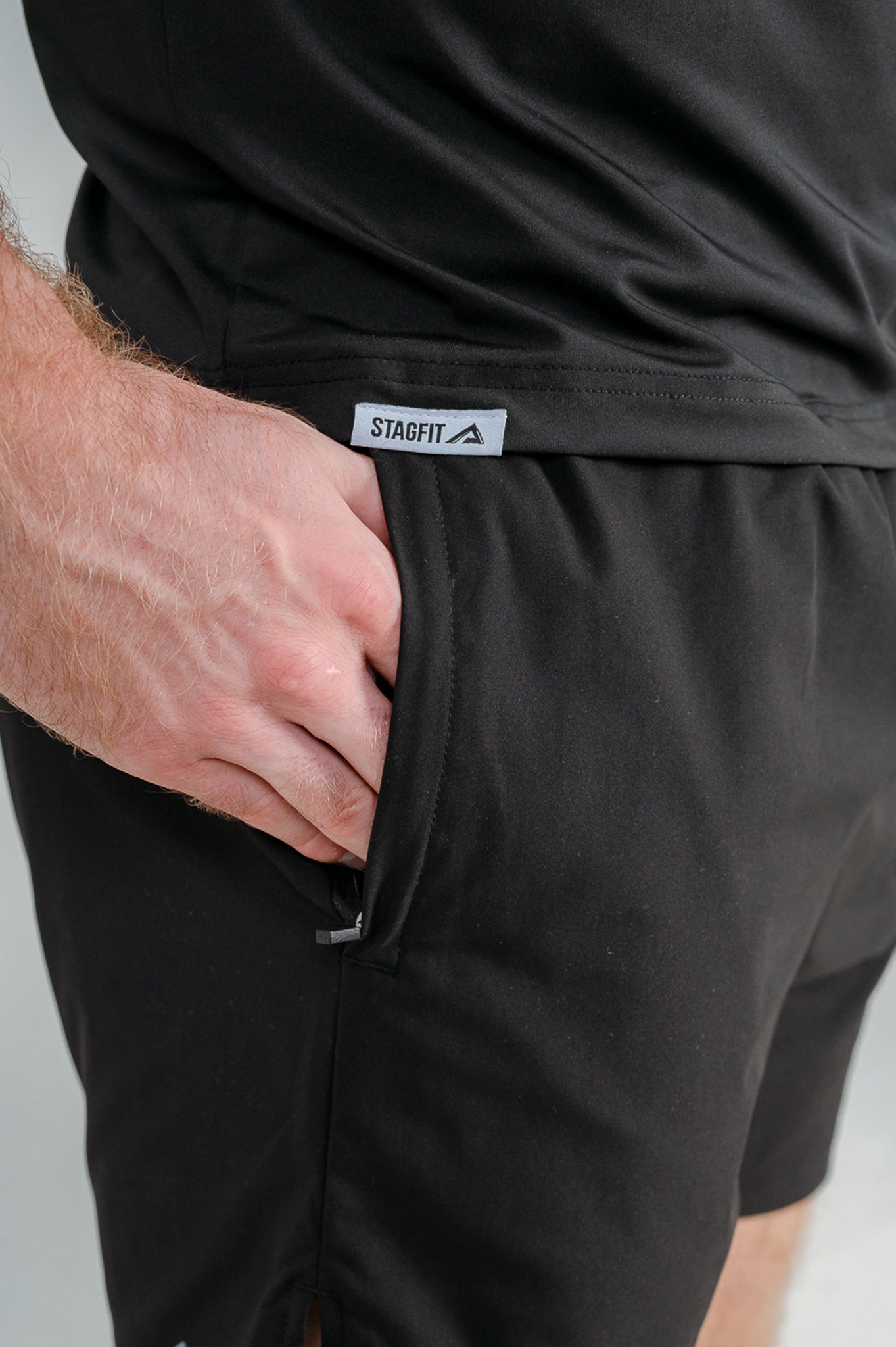 Close-up of hem tag, fabric and flat seams of StagFit t-shirt. 